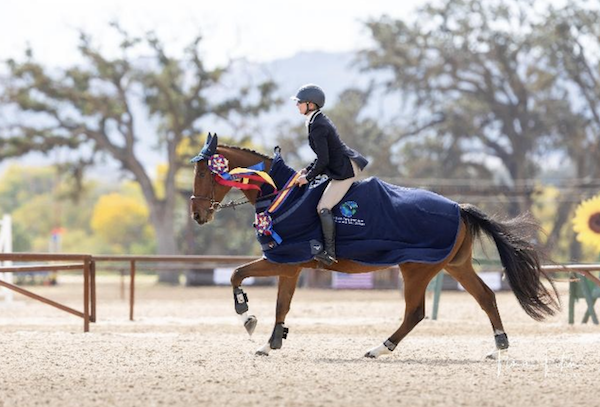 Earned Effort and Anna Collier win the 2025 USEA YEH West Coast 4-Year-Old Championship. Photo credit: Tina Fitch Photography