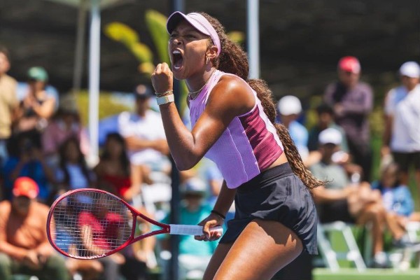 Thea Frodin celebrates a point during a tennis match